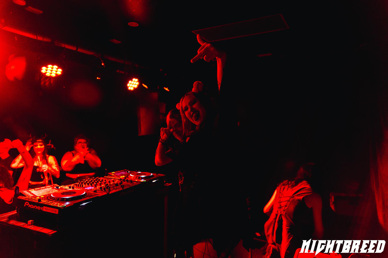 Nightbreed DJ heavy music club event audience